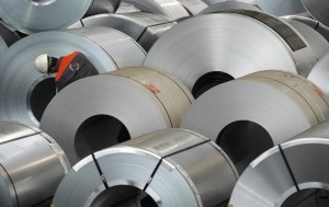 An employee inspects some steel at the plant of German steel company Salzgitter AG in Salzgitter.
